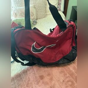 Nike maroon duffel bag barely used some wear pictured